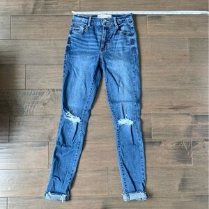 Medium wash ripped skinny jeans blue
